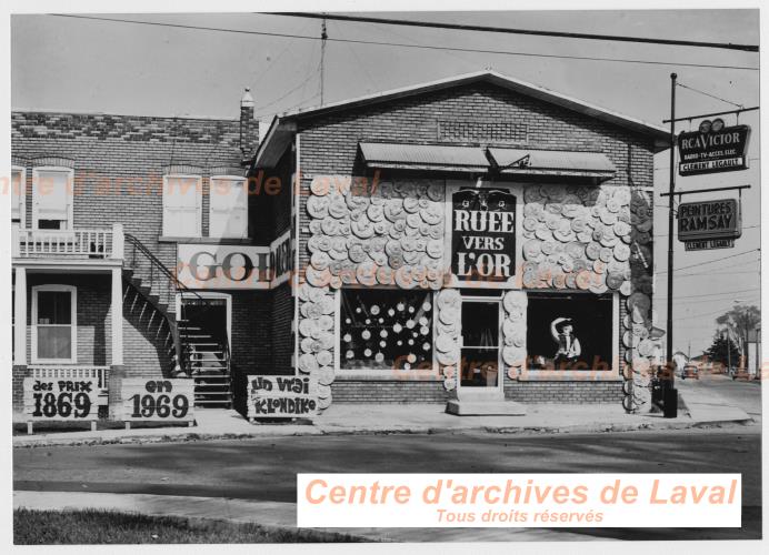 Commerce La rue vers l'or de Clment Legault,  Sainte-Scholastique